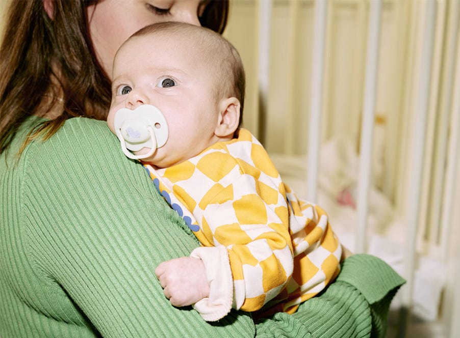 a mum holding her baby