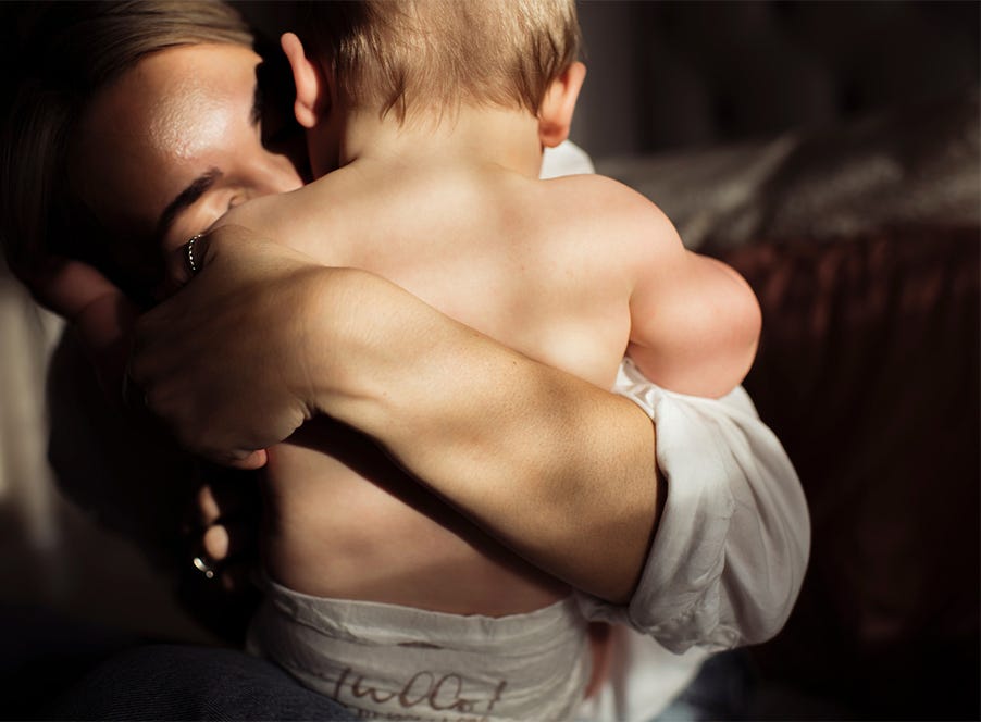 a mum holding her baby