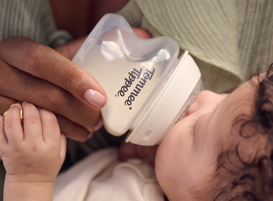 baby being fed bottle