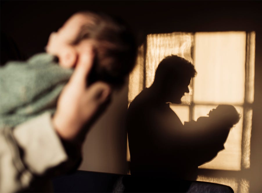 a dad holding his baby