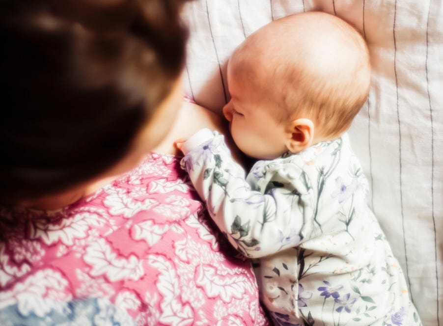 a mum breastfeeding her newborn baby