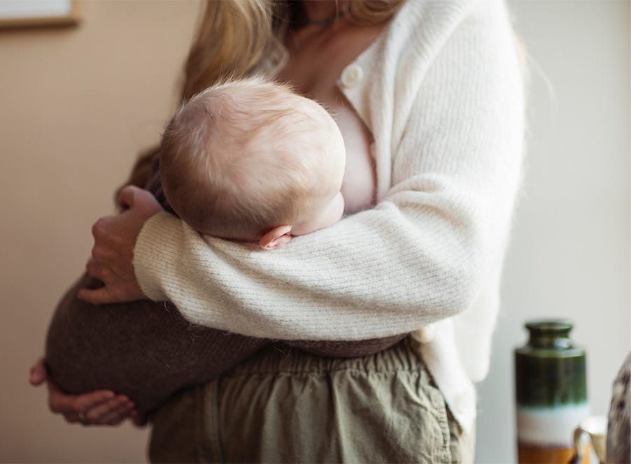 a mum breastfeeding her baby