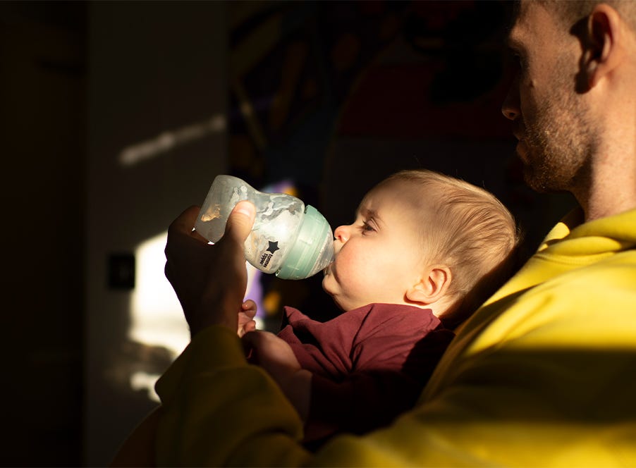 a baby bottle feeding