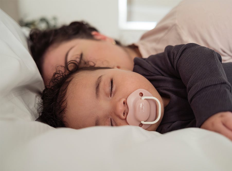 a mum in bed with her baby