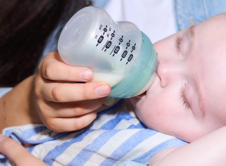 a baby bottle feeding