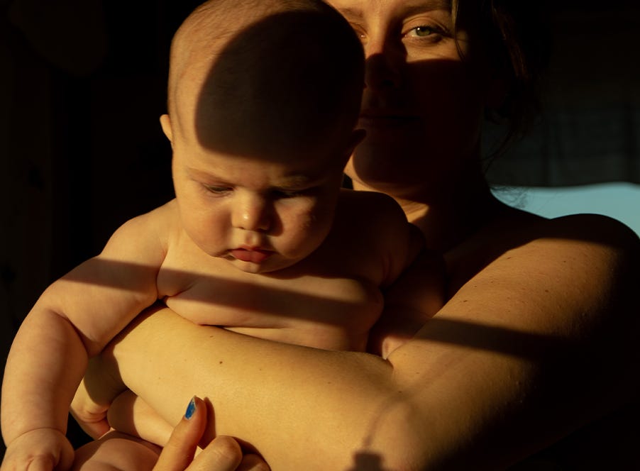 a mum holding her baby