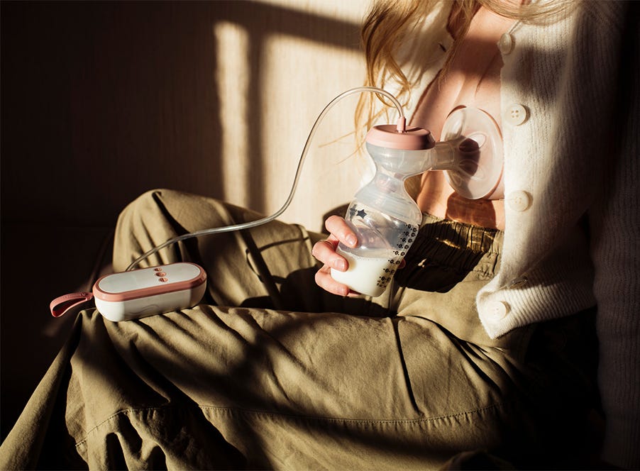 a mum using a breast pump