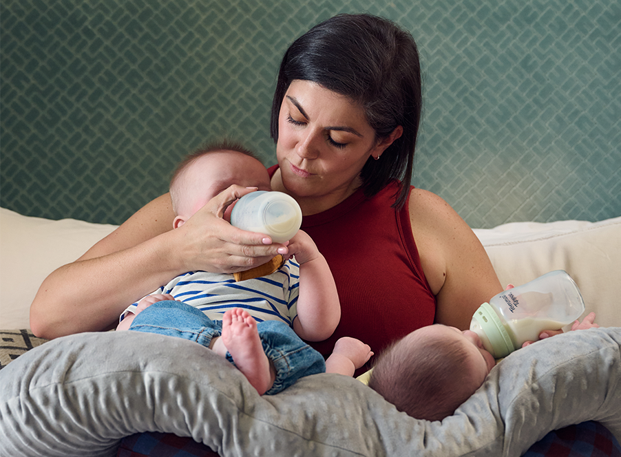 mum feeding twins bottles