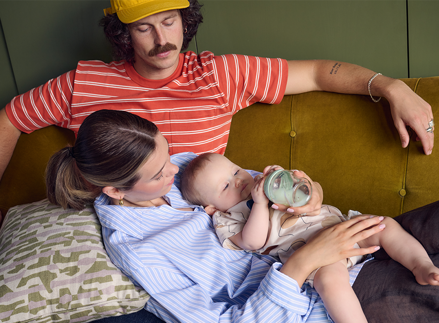 mum and dad holding baby