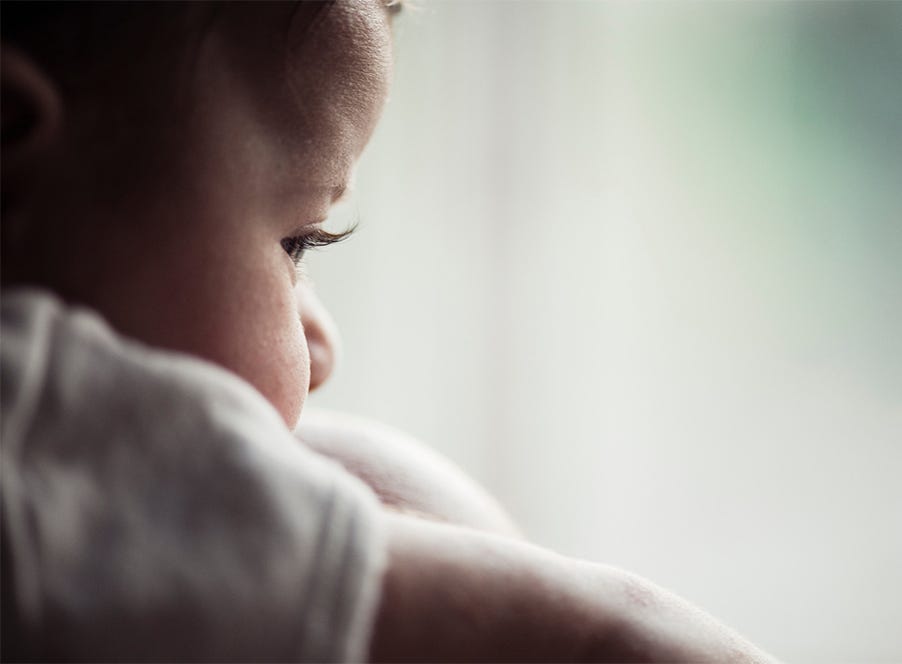 a baby looking out of the window
