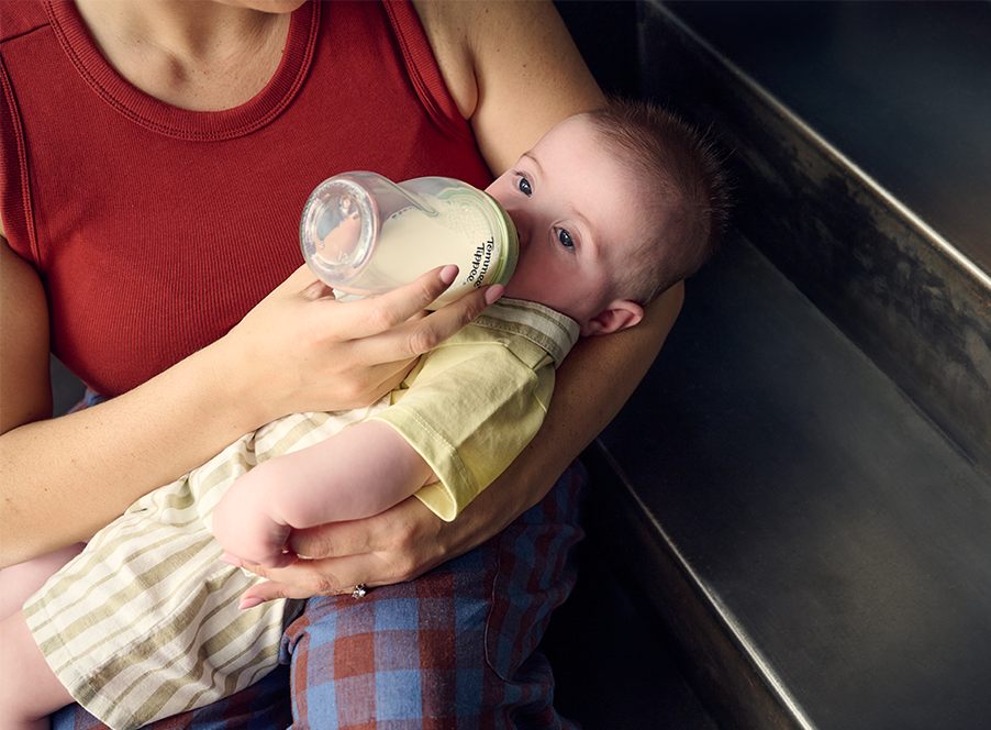 a mum feeding baby