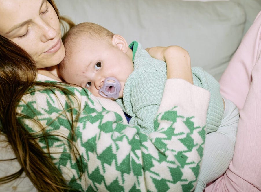 a mum holding her baby