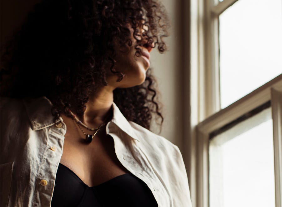 a woman looking out the window