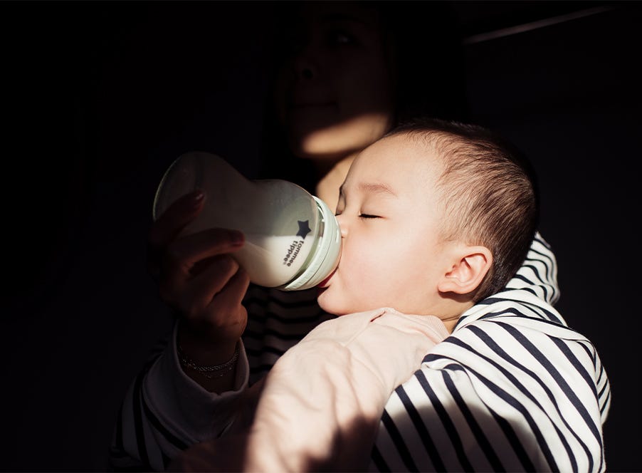 a mum feeding her baby during the night