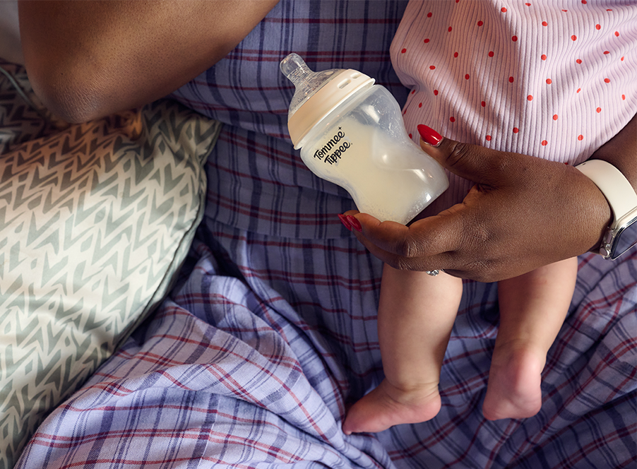 mum holding baby and bottle