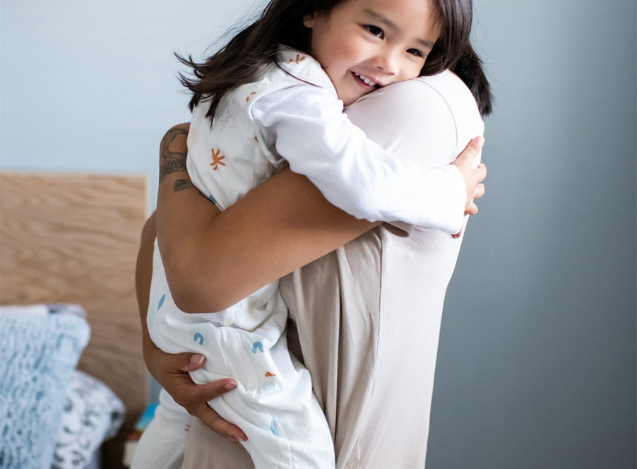 a mum carrying her toddler