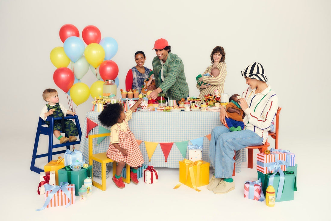 parents and kids at a birthday party table