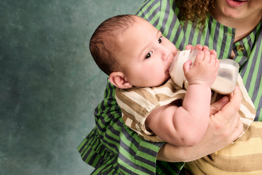baby drinking from bottle