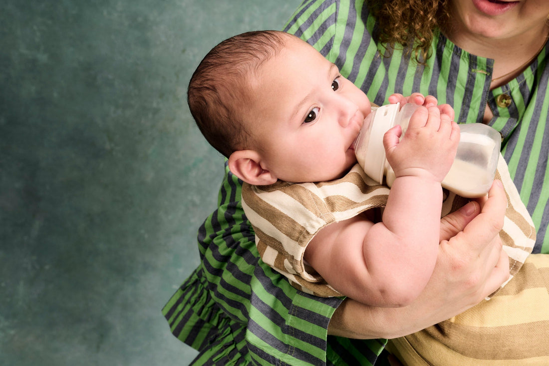 baby feeding from bottle