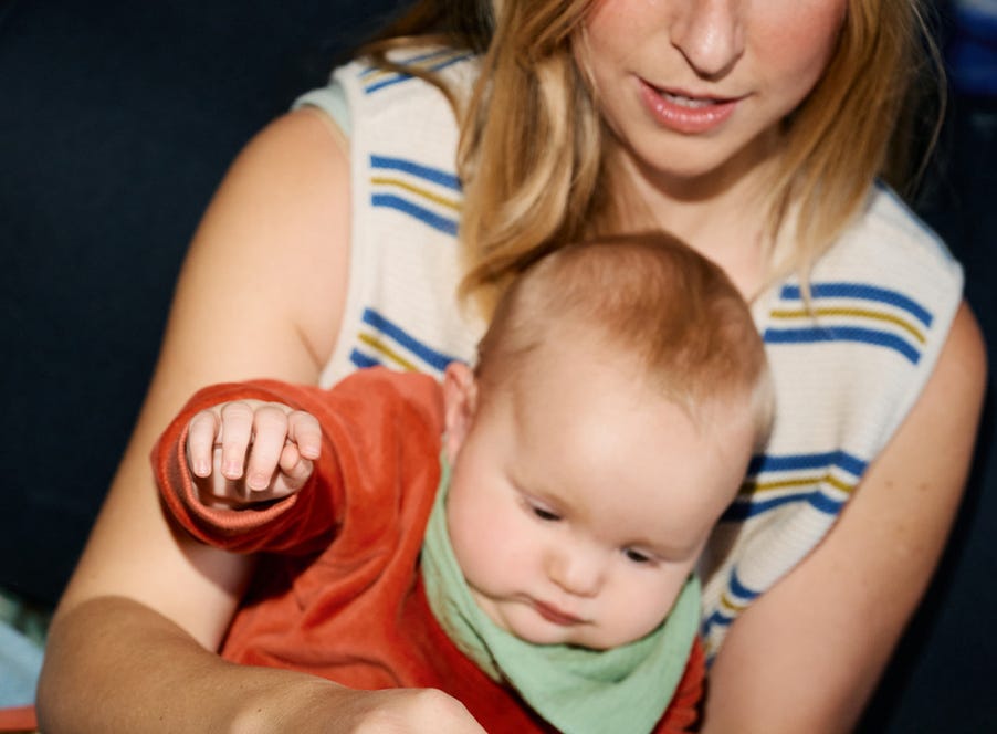 a mum holding her baby
