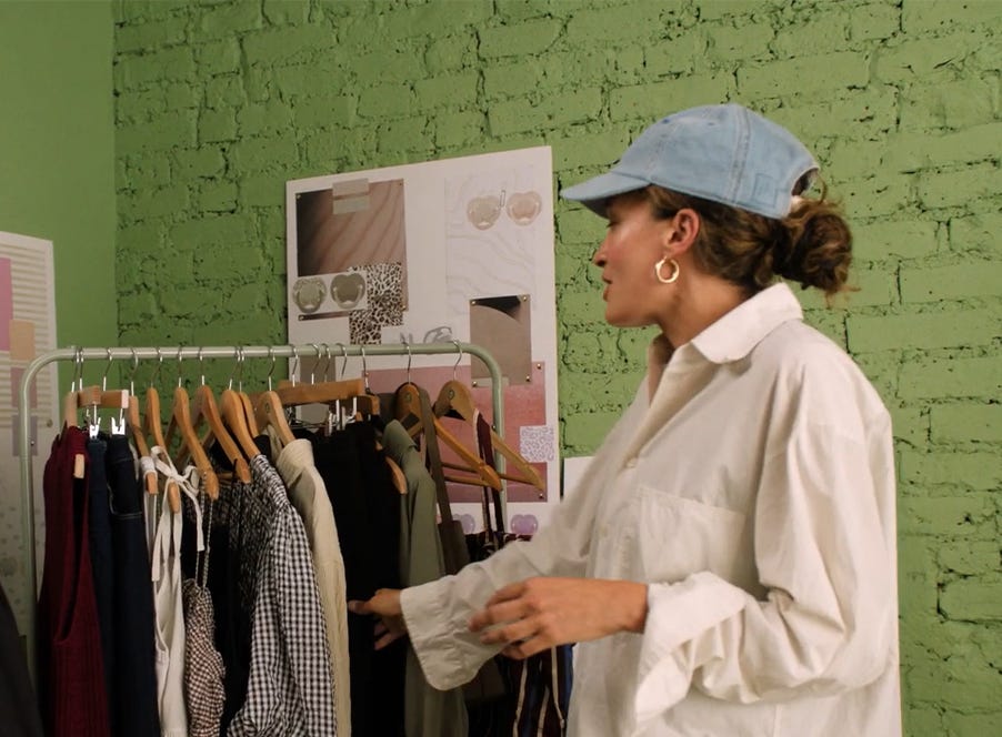 a stylist picking out clothes