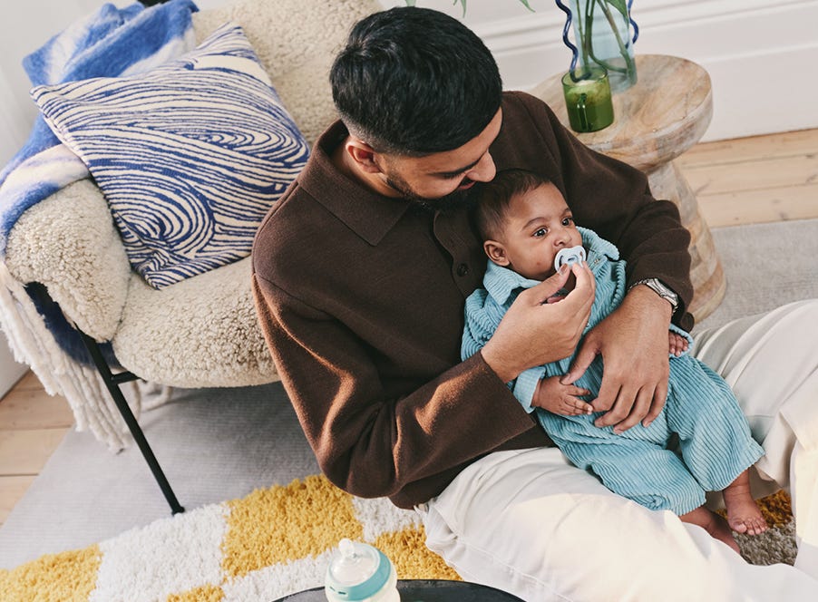 a dad holding his baby