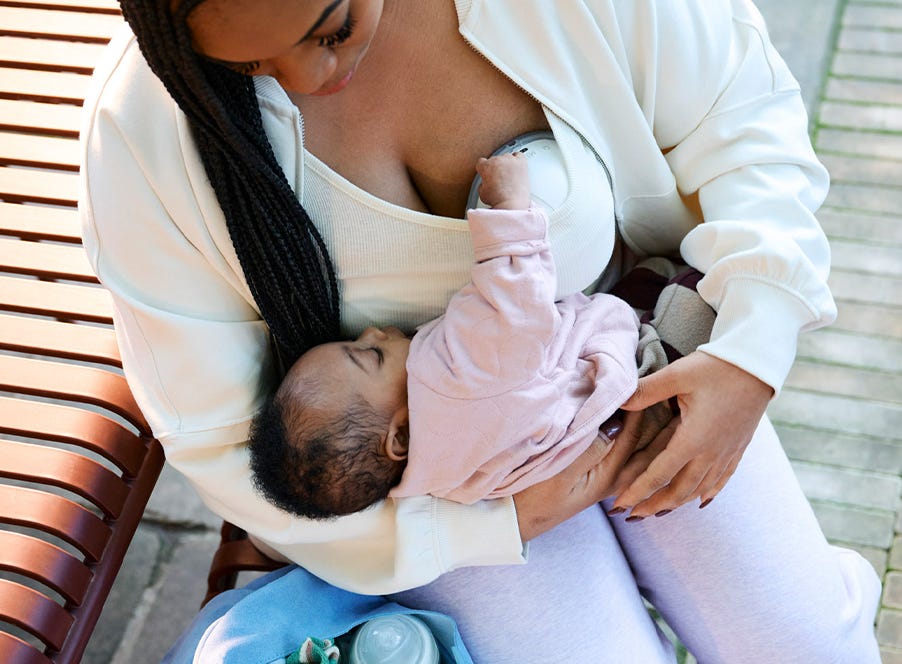 a mum using a wearable breast pump