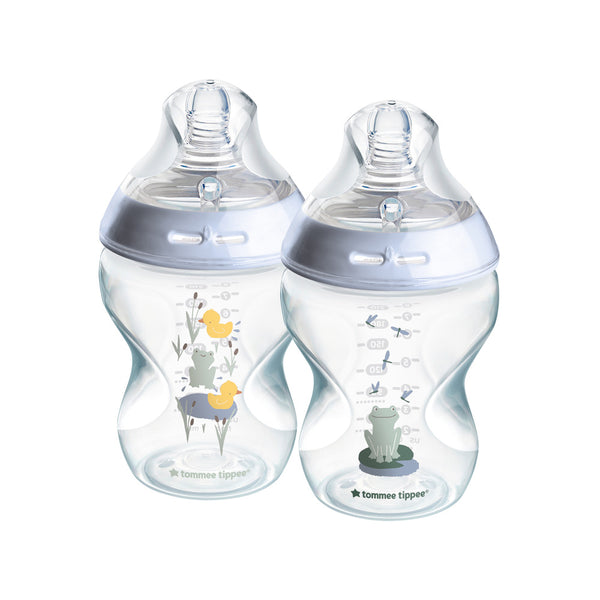 Two Tommee Tippee baby bottles with illustrations on a white background