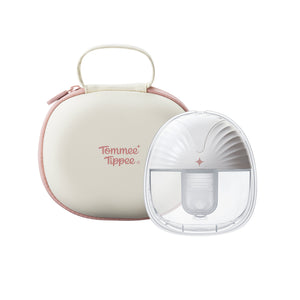 One front-facing wearable breast pumps in front of a Single carry case against a white background.