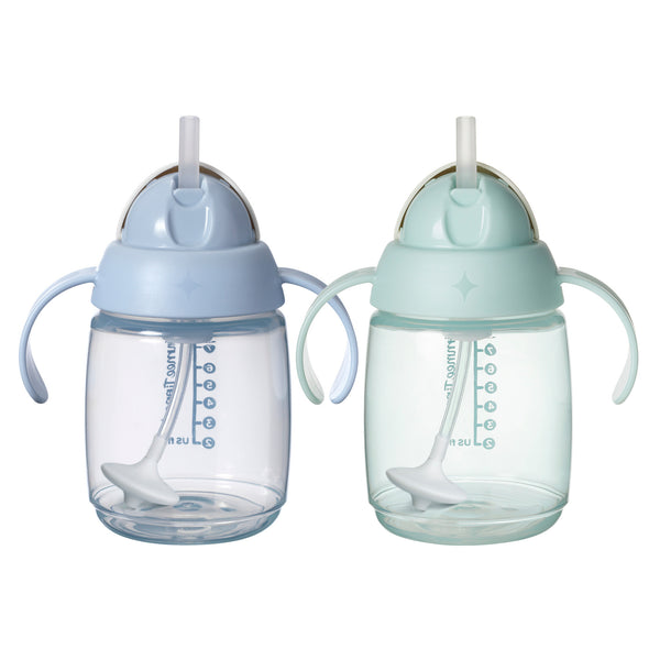 Two baby sippy cups with straws on a white background