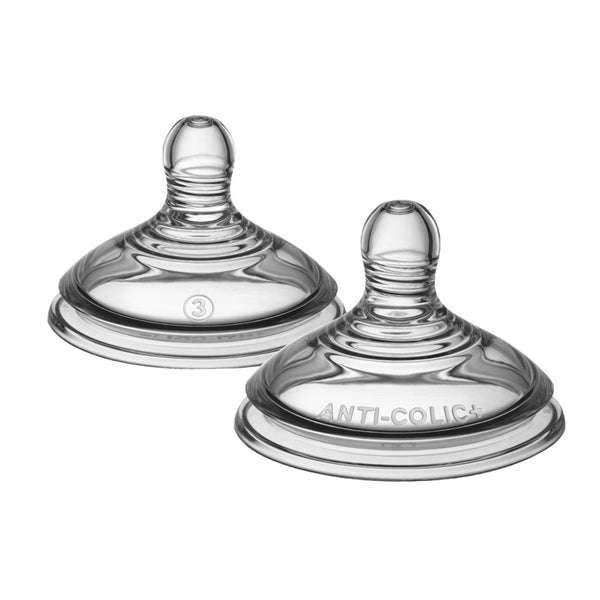Two clear baby bottle nipples with 'ANTI-COLIC' label on a white background