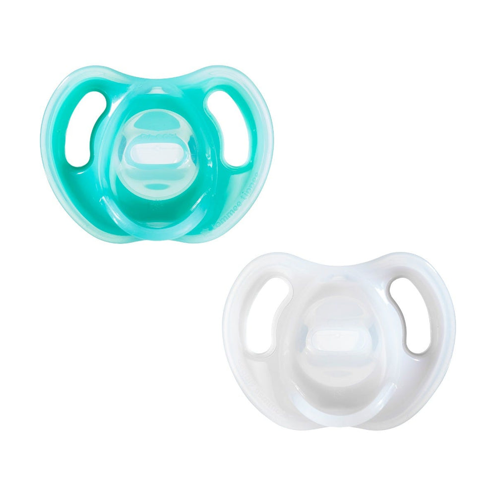 4 ultra light pacifiers next to packaging on a white background with a roundel stating that it was a 4 pack