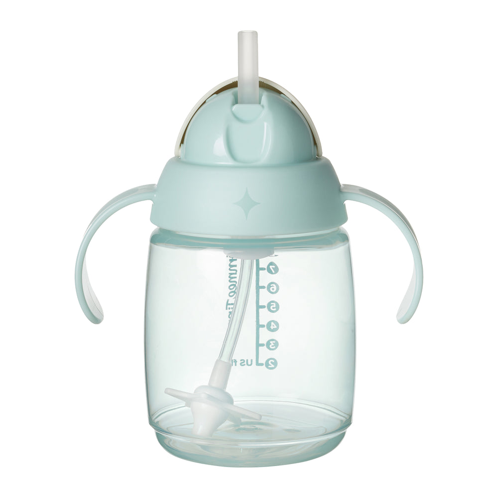 Light blue sippy cup with straw and handles on a white background
