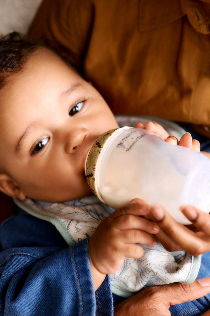 baby being fed bottle