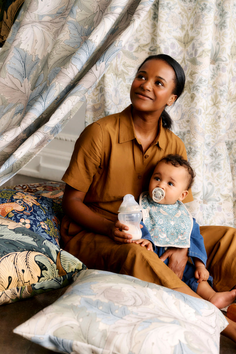 mum and baby sitting on cushions