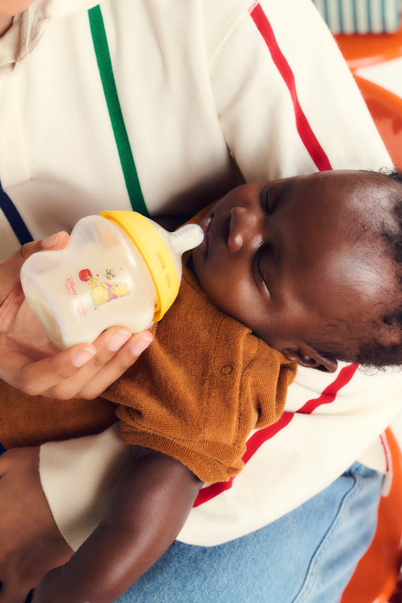 baby being fed bottle