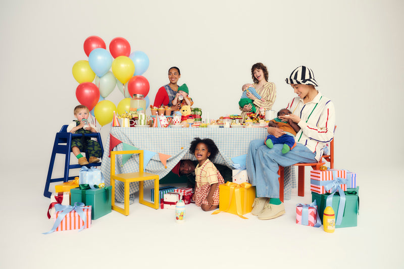 parents at a birthday party table