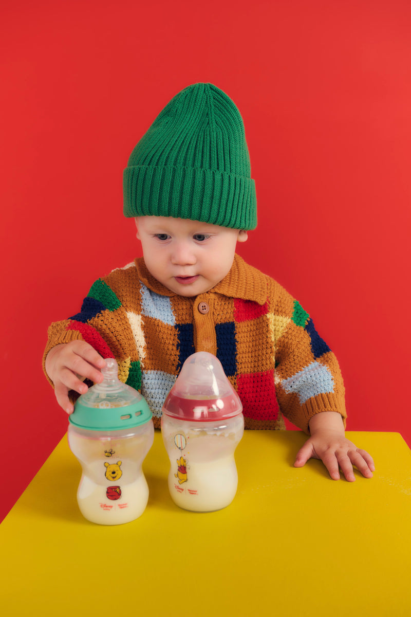 baby touching bottles