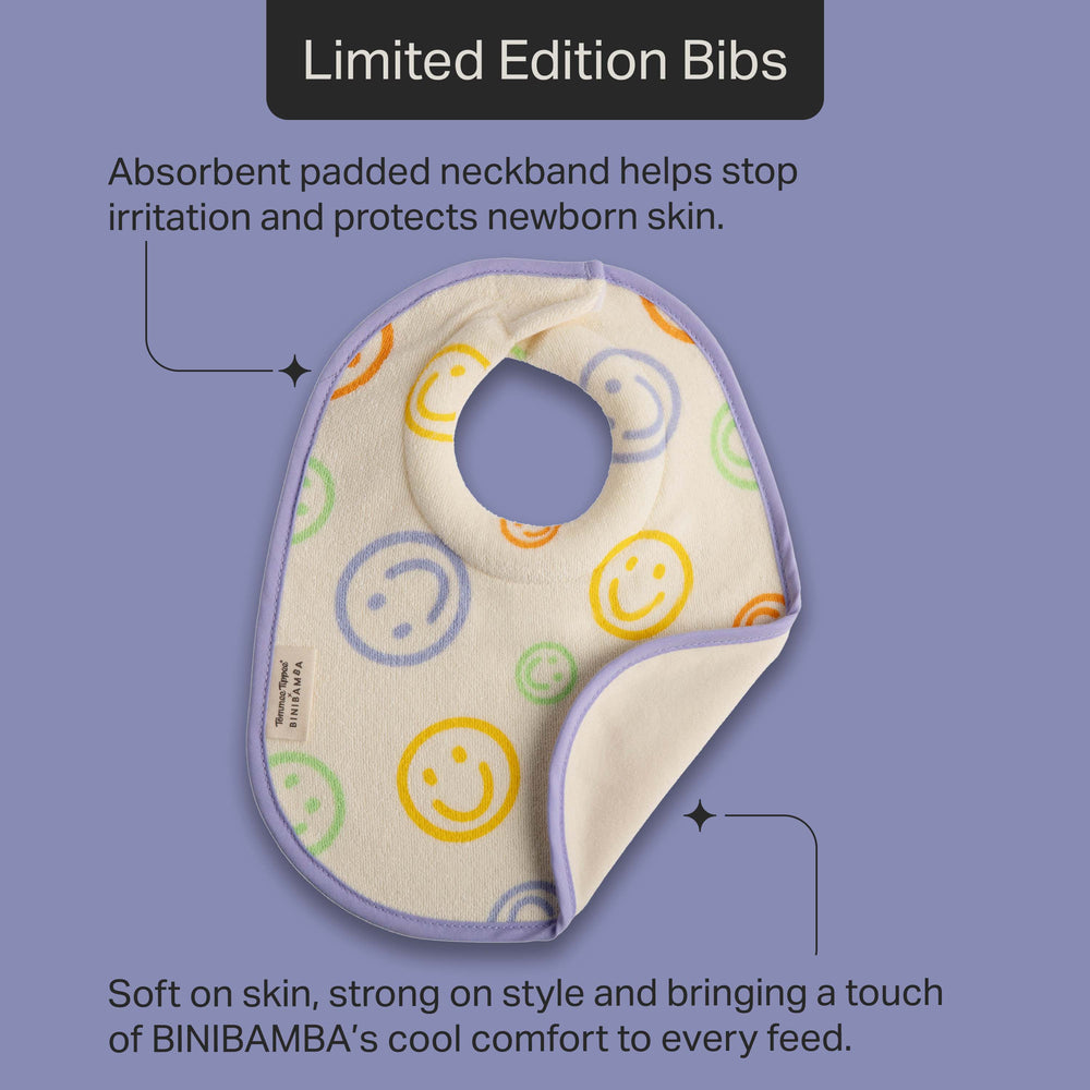 Tommee Tippee x BINIBAMBA milk feeding bib against a purple background with pointers to the product features stating “Absorbent padded neckband helps stop irritation and protects newborn skin” and “Soft on skin, strong on style and bringing a touch of BINIBAMBA’s cool comfort to every feed.” 