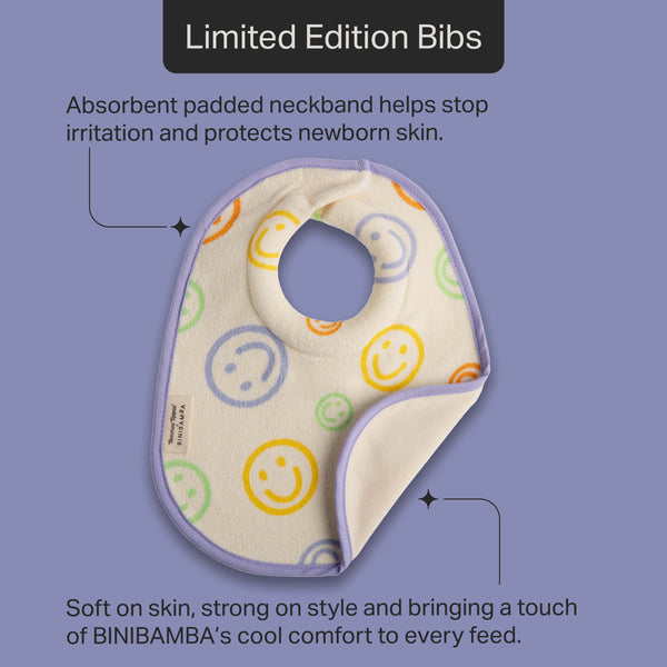 Tommee Tippee x BINIBAMBA milk feeding bib against a purple background with pointers to the product features stating “Absorbent padded neckband helps stop irritation and protects newborn skin” and “Soft on skin, strong on style and bringing a touch of BINIBAMBA’s cool comfort to every feed.” 