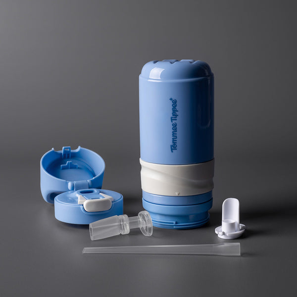 Blue on-the-go straw cup against a dark grey background disassembled to show all the pieces