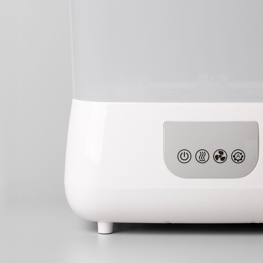 Close up of the buttons on the front of a SteriDryer against a grey background