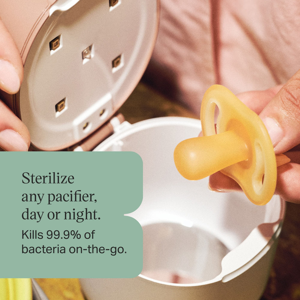 Parent putting a soother in the pod with text overlay about sterilising any dummy.
