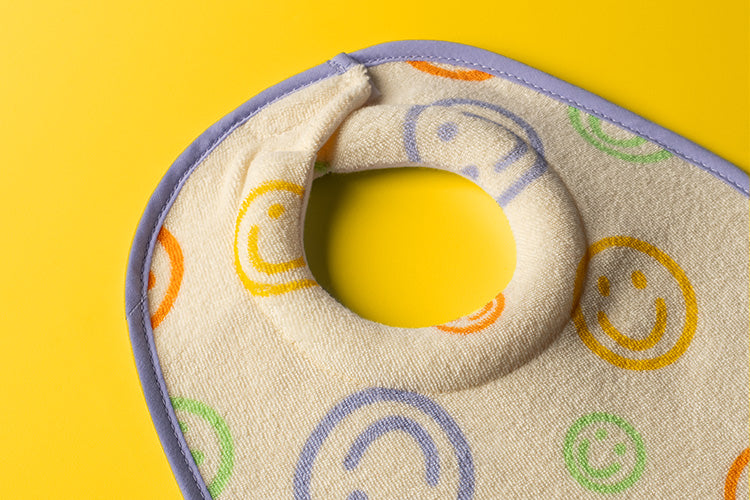 Tommee Tippee x Binibamba Bib on yellow background