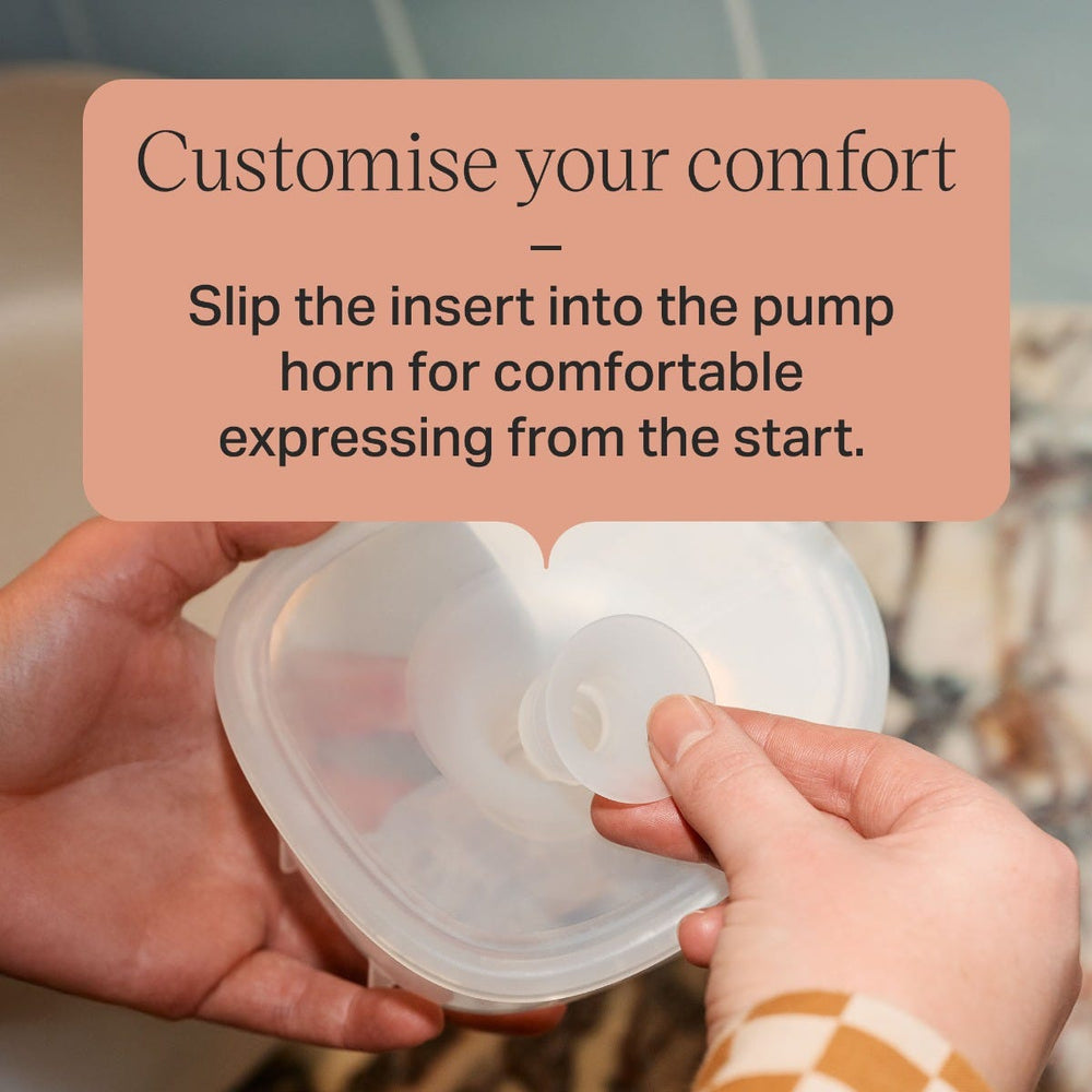 Parent slotting a size insert into the flange below text overlay: 