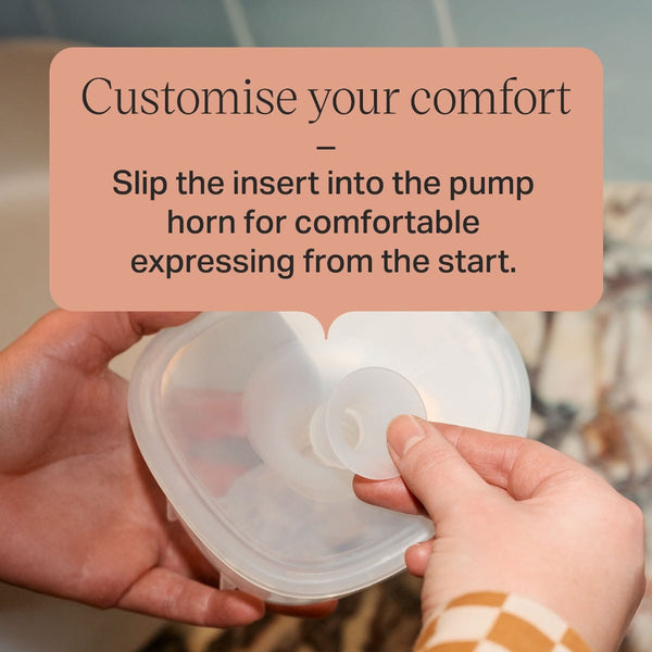 Parent slotting a size insert into the flange below text overlay: 