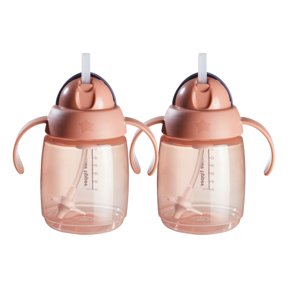Pink weighted straw cup against a white background