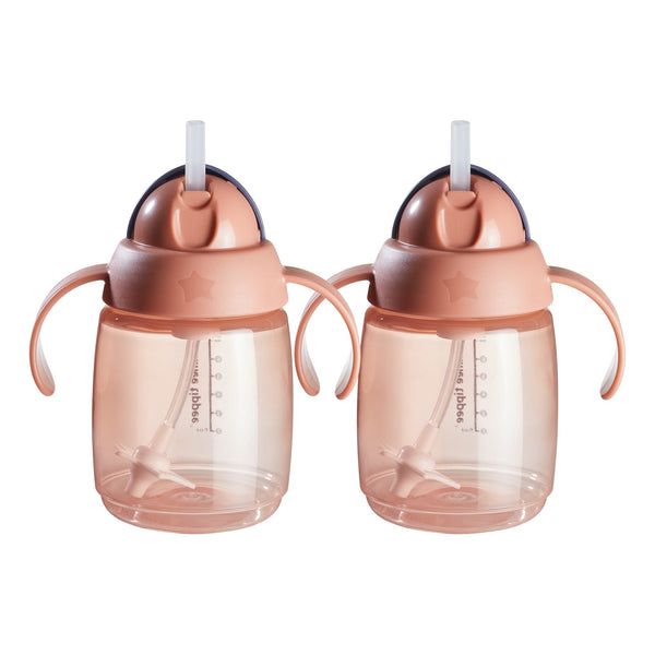 Pink weighted straw cup against a white background