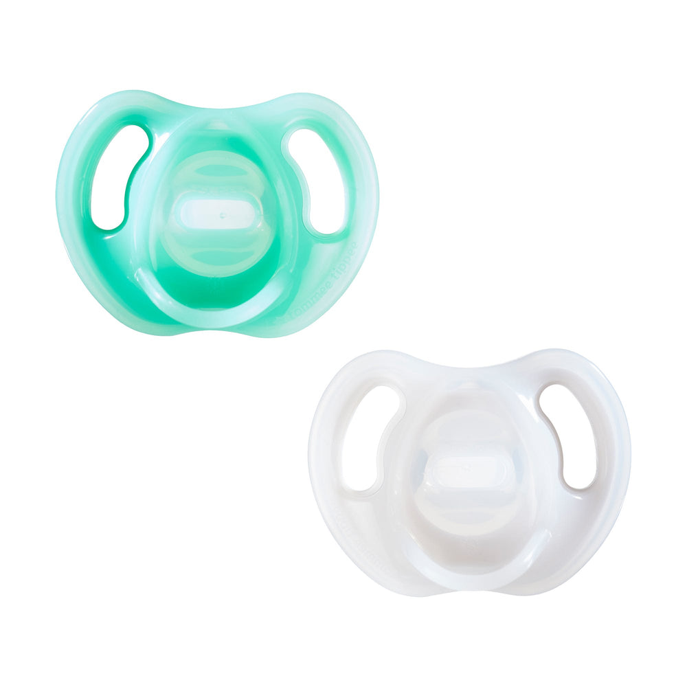 Pacifiers on a white background.