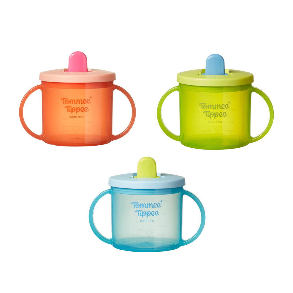 Three Tommee Tippee First Cups against a white background